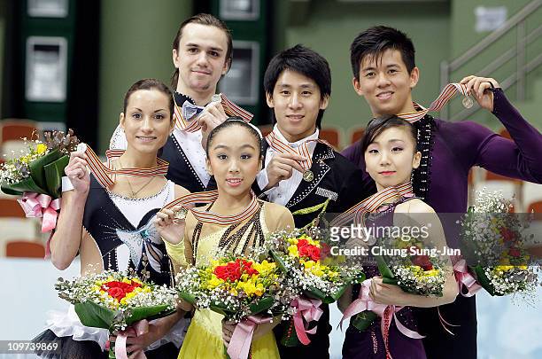 2nd place winner Ksenia Stolbova and Fedor Klimov of Russia, 1st place winner Wenjing Sui and Cong Han of China and 3rd place winner Narumi Takahashi...