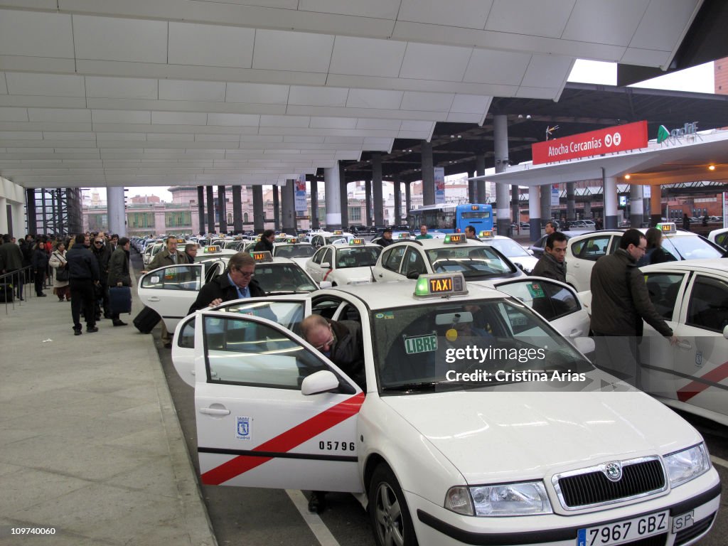 Travelers accessing taxis in the arrivals terminal, Puerta de Atocha station, Madrid