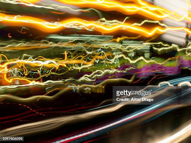 high-speed race that leaves trails of light - motorsport abstract stock pictures, royalty-free photos & images