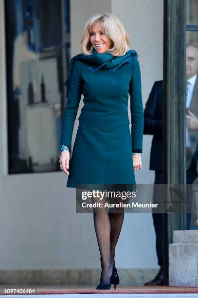 French First Lady Brigitte Macron escorts out Isabelle Brais after a meeting between French President Emmanuel Macron and Quebec Prime Minister...