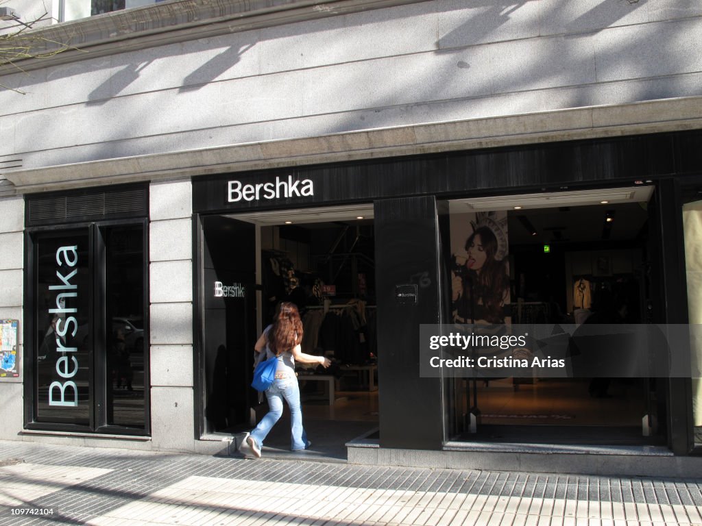 Young woman entering a store of Bershka, BERSHKA is the brand of ...