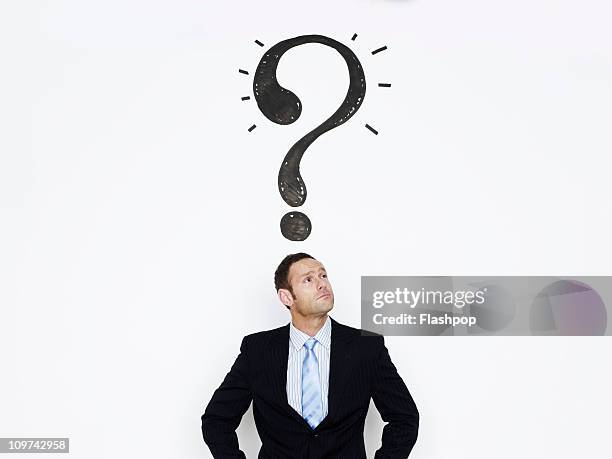 businessman with question mark over his head - manquestionmark stock pictures, royalty-free photos & images