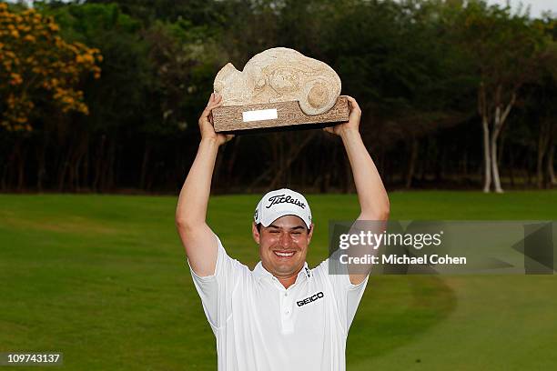 Johnson Wagner holds the trophy after winning the Mayakoba Golf Classic at Riviera Maya-Cancun held at El Camaleon Golf Club on February 27, 2011 in...