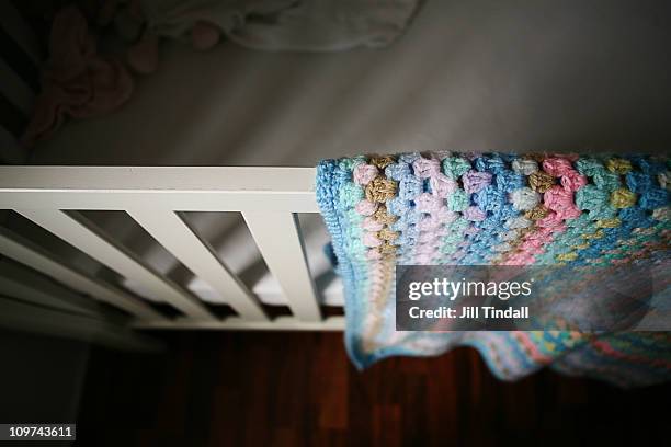 shadows on baby's cot - babybett stock-fotos und bilder