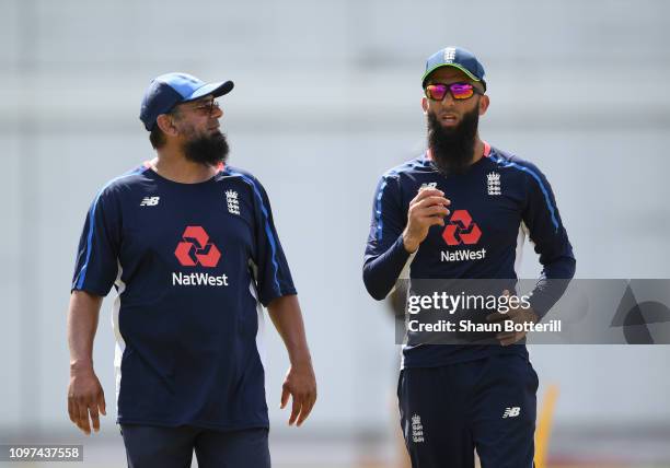 Moeen Ali of England talks with bowling coach Saqlain Mushtaq during a net session at Kensington Oval on January 21, 2019 in Bridgetown, Barbados.