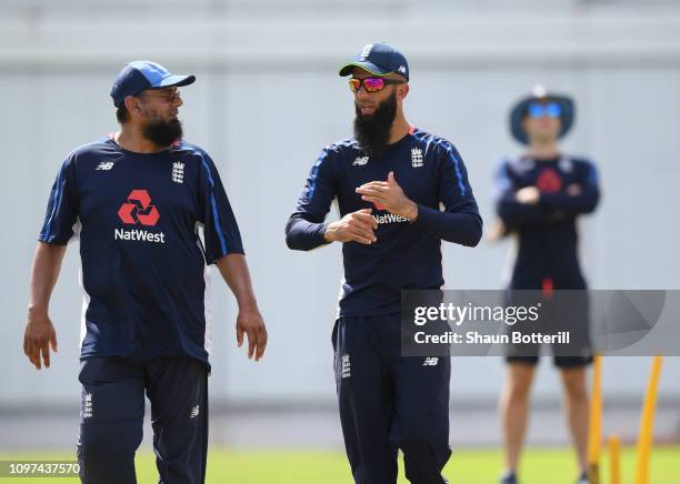 Moeen Ali of England talks with bowling coach Saqlain Mushtaq during a net session at Kensington Oval on January 21, 2019 in Bridgetown, Barbados.