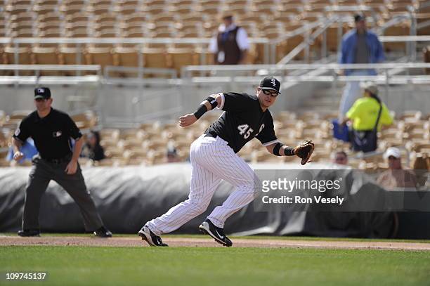Dallas McPherson of the Chicago White Sox fields against the Milwaukee Brewers on March 01, 2011 at The Ballpark at Camelback Ranch in Glendale,...