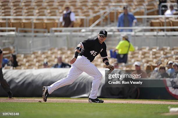 Dallas McPherson of the Chicago White Sox fields against the Milwaukee Brewers on March 01, 2011 at The Ballpark at Camelback Ranch in Glendale,...