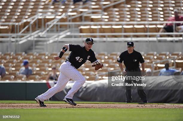 Dallas McPherson of the Chicago White Sox fields against the Milwaukee Brewers on March 01, 2011 at The Ballpark at Camelback Ranch in Glendale,...