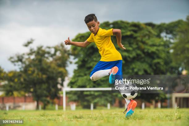soccer player child - brazil and outside and ball stock pictures, royalty-free photos & images