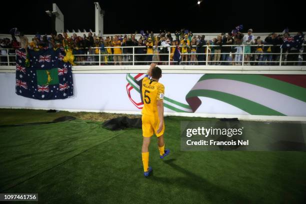 Mark Milligan of Australia acknowledges the fans following his sides victory after a penalty shoot-out in the AFC Asian Cup round of 16 match between...