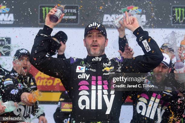 Jimmie Johnson, driver of the Ally Chevrolet, celebrates in victory lane after winning the Monster Energy NASCAR Cup Series Advance Auto Parts Clash...