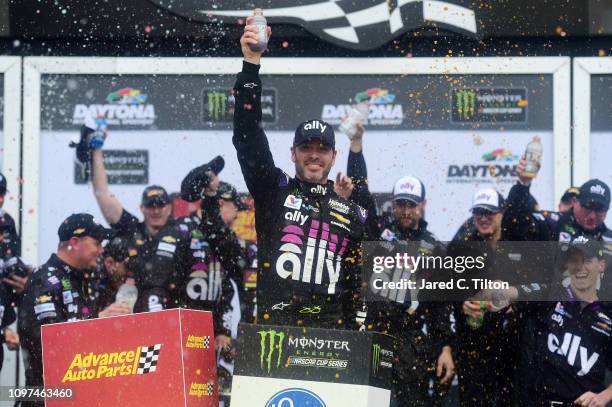 Jimmie Johnson, driver of the Ally Chevrolet, celebrates in victory lane after winning the Monster Energy NASCAR Cup Series Advance Auto Parts Clash...