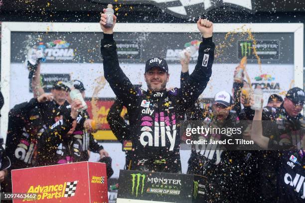 Jimmie Johnson, driver of the Ally Chevrolet, celebrates in victory lane after winning the Monster Energy NASCAR Cup Series Advance Auto Parts Clash...