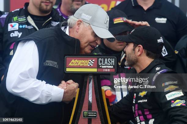 Team owner Rick Hendrick congratulates Jimmie Johnson, driver of the Ally Chevrolet, after winning the Monster Energy NASCAR Cup Series Advance Auto...