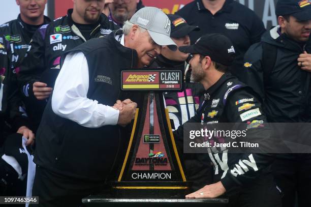Team owner Rick Hendrick congratulates Jimmie Johnson, driver of the Ally Chevrolet, after winning the Monster Energy NASCAR Cup Series Advance Auto...