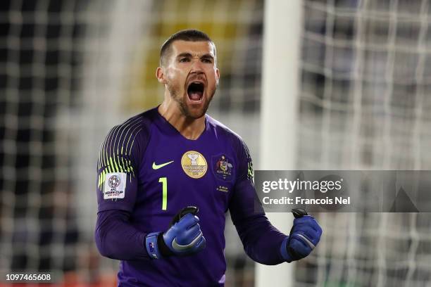 Mat Ryan of Australia celebrates after saving the fourth penalty from Marat Bikmaev of Uzbekistan in the penalty shoot out during the AFC Asian Cup...