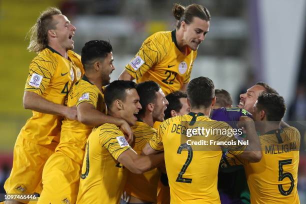 Mat Ryan of Australia celebrates with his teammates following their sides win after a penalty shoot-out in the AFC Asian Cup round of 16 match...