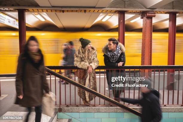 lovely romantic couple spending time together at a metro station - berlin subway stock pictures, royalty-free photos & images