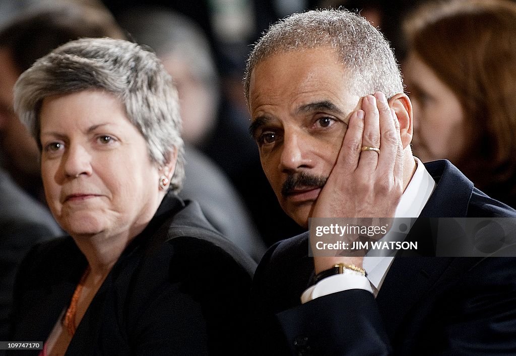 US Attorney General Eric Holder (R) and