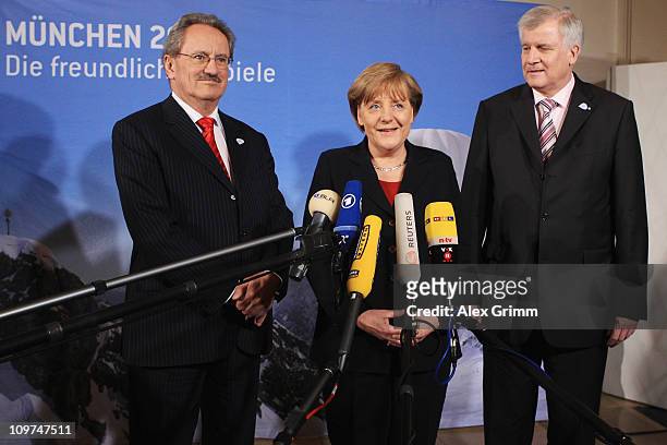 German Chancellor Angela Merkel , Christian Ude, lord mayor of Munich and Bavaria's State Premier Horst Seehofer address the media during a reception...