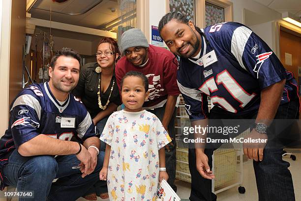 New England Patriots players Rob Ninkovich and Jerod Mayo spread cheer to patient Ashon March 3, 2011 at Children's Hospital Boston in Boston,...