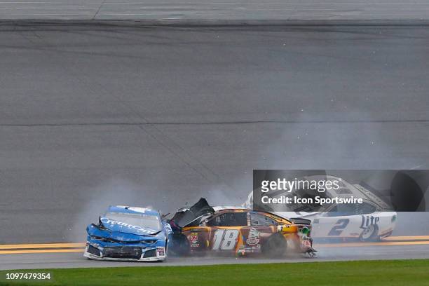 Kyle Larson, driver of the Credit One Bank Chevy, and Kyle Busch, driver of the M&Ms Chocolate Bar Toyota, collide during the Advance Auto Parts...