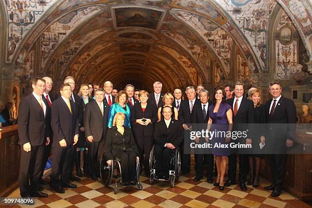 Gunilla Lindberg, chairwoman of the IOC Evaluation Commission, and German Chancellor Angela Merkel pose with the Commission and guests during a...