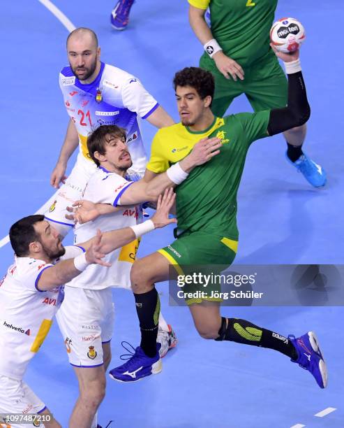 Gedeon Guardiola Vilaplana of Spain and Viran Morros de Argila of Spain challenge Jose Toledo of Brazil during the 26th IHF Men's World Championship...