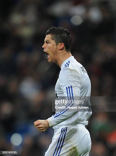 Cristiano Ronaldo of Real Madrid celebrates scoring from the penalty spot during the la Liga match between Real Madrid and Malaga at Estadio Santiago...