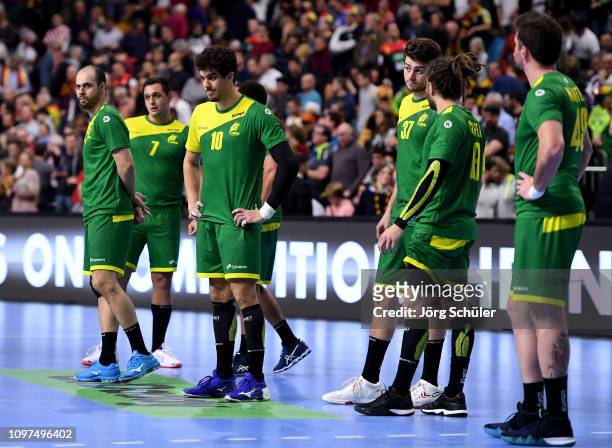 Jose Toledo of Brazil and his team mates are looking dejected after loosing the 26th IHF Men's World Championship group 1 match between Spain and...