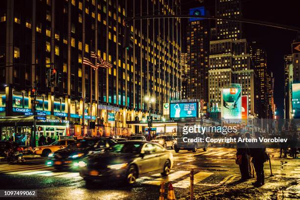 madison square garden at night - penn station stock pictures, royalty-free photos & images