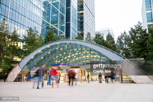 blurred people walking in front of modern office building, london - canary wharf stock pictures, royalty-free photos & images