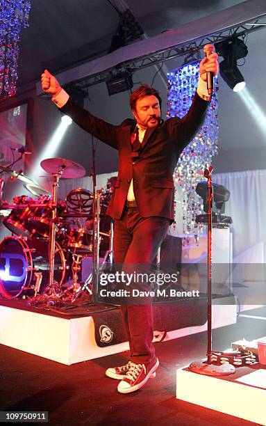 Simon Le Bon of Duran Duran performs on stage at the Ice & Diamonds Send-Off Ball in aid of Walking With The Wounded at Battersea Power station on...