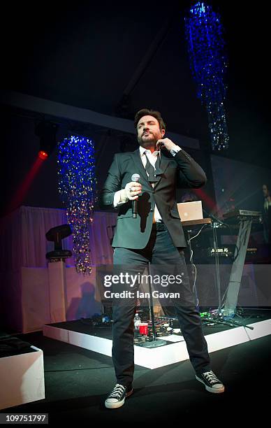 Simon Le Bon performs live with Duran Duran during the Ice & Diamonds Send-Off Ball in aid of Walking With The Wounded at Battersea Power station on...