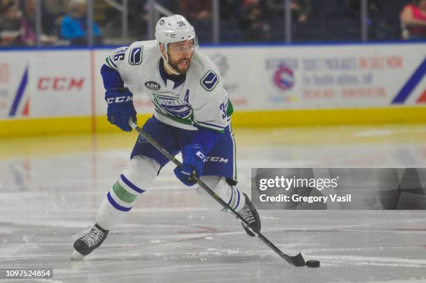 Wacey Hamilon of the Utica Comets brings the puck up ice during a game against the Bridgeport Sound Tigers at Webster Bank Arena on February 10, 2019...