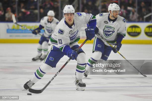Kole Lind of the Utica Comets brings the puck up ice during a game against the Bridgeport Sound Tigers at Webster Bank Arena on February 10, 2019 in...