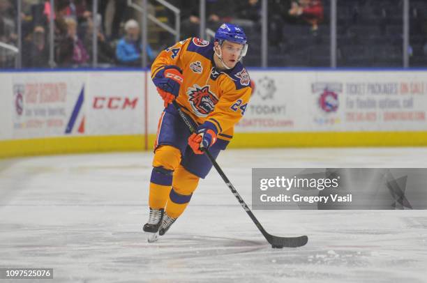 Travis St. Denis of the Bridgeport Sound Tigers brings the puck up ice during a game against the Utica Comets at Webster Bank Arena on February 10,...