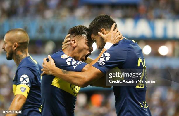 Lisandro Lopez of Boca Juniors celebrates with Cristian Pavon after scoring the first goal of his team during a match between Belgrano and Boca...
