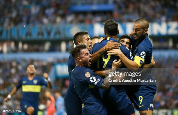 Lisandro Lopez of Boca Juniors celebrates with teammates after scoring the first goal of his team during a match between Belgrano and Boca Juniors as...