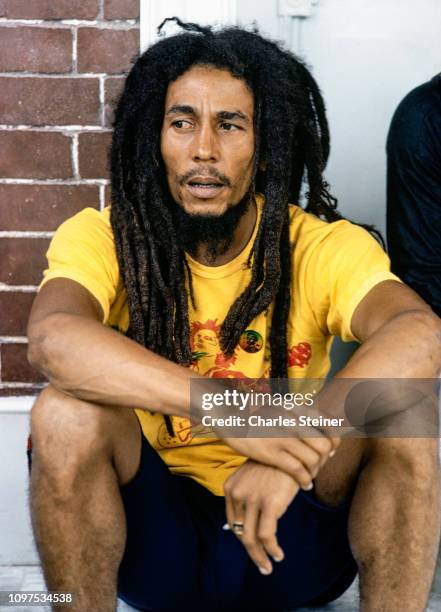 Bob Marley relaxes with friends in front of his house at 56 Hope Road on July 9, 1979 in Kingston, Jamaica.