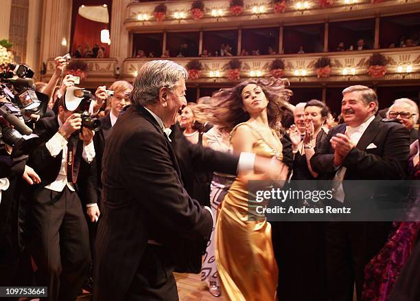 Austrian entrepreneur Richard Lugner and Moroccan-born pole dancer Karima El Mahroug, nicknamed 'Ruby the Heart Stealer' attend the traditional...