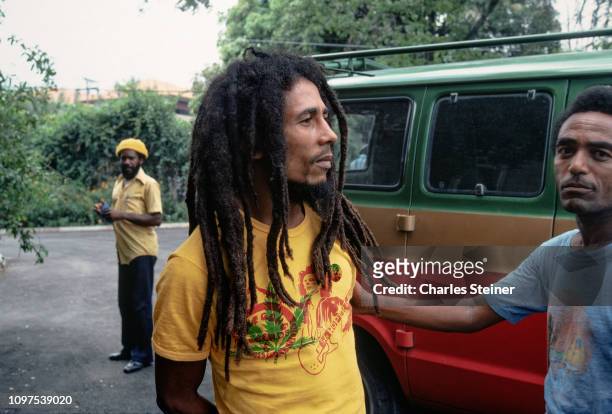 Bob Marley relaxes with friends in front of his house at 56 Hope Road on July 9, 1979 in Kingston, Jamaica.