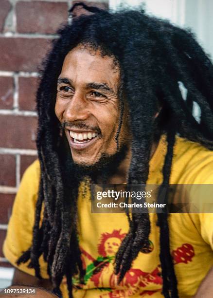 Bob Marley relaxes with friends in front of his house at 56 Hope Road on July 9, 1979 in Kingston, Jamaica.