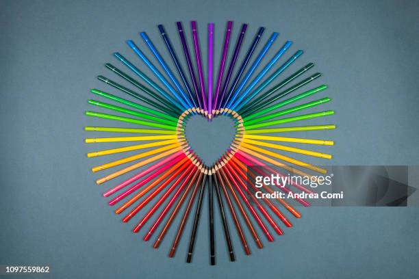 colored pencils arranged to create a heart shape - heart entertainment group stock pictures, royalty-free photos & images