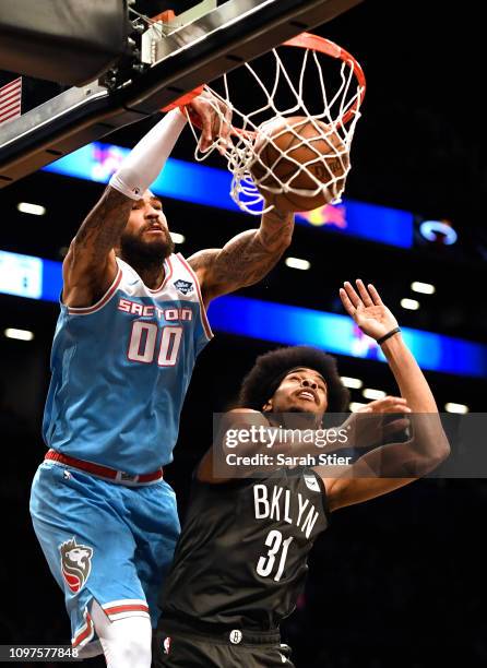 Willie Cauley-Stein of the Sacramento Kings dunks against Jarrett Allen of the Brooklyn Nets during the second quarter of the game at Barclays Center...