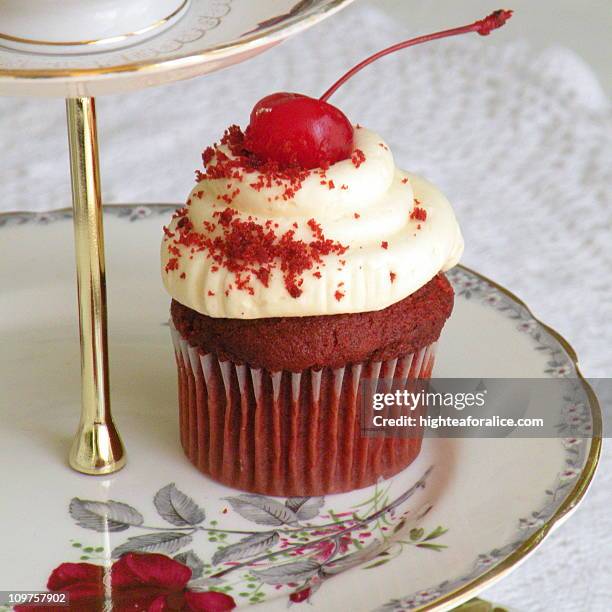 red velvet cupcake with cherry on top - cherry on top stock-fotos und bilder