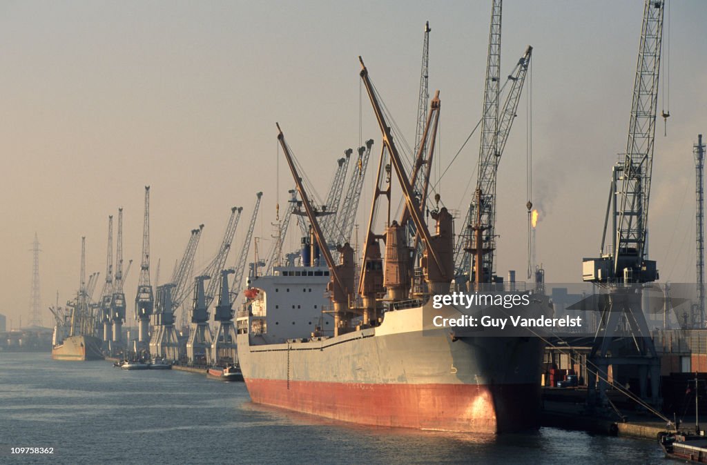 Ship in dock with cranes in Port of Antwerp.