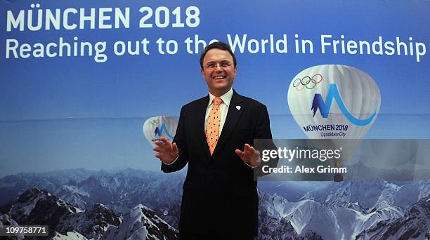 German Interior Minister Hans-Peter Friedrich poses before a press conference at the Munich 2018 media center on March 4, 2011 in Munich, Germany....