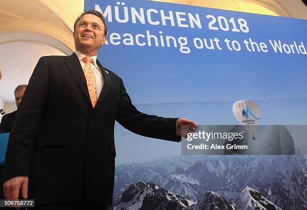 German Interior Minister Hans-Peter Friedrich poses before a press conference at the Munich 2018 media center on March 4, 2011 in Munich, Germany....